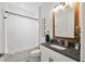 Charming bathroom with shower-tub, granite counters, and modern fixtures for a comfortable experience at 12643 Shetland Walk Dr, Lithia, FL 33547