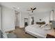 Bright bedroom with neutral color palette, ceiling fan, and stylish decor for a relaxing retreat at 12643 Shetland Walk Dr, Lithia, FL 33547