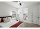 Bright bedroom with comfortable furnishings, ceiling fan, and closet space at 12643 Shetland Walk Dr, Lithia, FL 33547