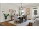 Elegant dining room featuring a wooden table, upholstered chairs, and stylish lighting at 12643 Shetland Walk Dr, Lithia, FL 33547