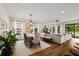 Bright open-concept space with dining and living areas, hardwood floors, and plenty of natural light at 12643 Shetland Walk Dr, Lithia, FL 33547