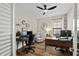 Functional home office with ample workspace, hardwood floors, and a comfortable chair for focus at 12643 Shetland Walk Dr, Lithia, FL 33547