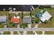 An aerial view shows the property with a well-maintained yard and access to a canal with dock at 12829 3Rd Isle, Hudson, FL 34667