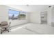 Bright and airy living room with a large window and open layout, ready to be transformed into your dream space at 12829 3Rd Isle, Hudson, FL 34667