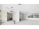 Blank-canvas living area featuring bright white walls and ample natural light for a personalized touch at 12829 3Rd Isle, Hudson, FL 34667