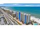 Stunning aerial view of a beachfront condo complex, turquoise waters, and coastline at 14950 Gulf Blvd # 902, Madeira Beach, FL 33708