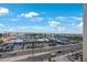 Scenic aerial view of the building, showing the surrounding city and beautiful blue sky with puffy white clouds at 14950 Gulf Blvd # 902, Madeira Beach, FL 33708