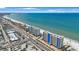 Wide aerial shot of beachfront condos, capturing the coastal beauty and convenient beachfront access at 14950 Gulf Blvd # 902, Madeira Beach, FL 33708