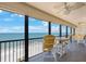Gorgeous balcony offers scenic ocean views, a ceiling fan and comfortable Adirondack chairs at 14950 Gulf Blvd # 902, Madeira Beach, FL 33708