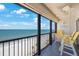 Scenic balcony with breathtaking ocean views, featuring comfortable seating at 14950 Gulf Blvd # 902, Madeira Beach, FL 33708