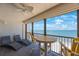 Relax on this cozy balcony, featuring stylish chairs and a lovely view of the ocean at 14950 Gulf Blvd # 902, Madeira Beach, FL 33708