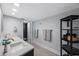 Modern bathroom features double sinks, granite countertops, a shelf unit and a glass-door shower at 14950 Gulf Blvd # 902, Madeira Beach, FL 33708