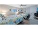 Charming bedroom featuring two beds with colorful comforters and coastal themed decor at 14950 Gulf Blvd # 902, Madeira Beach, FL 33708