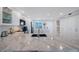 Updated kitchen with granite countertops and modern appliances, seamless design for an efficient workspace at 14950 Gulf Blvd # 902, Madeira Beach, FL 33708