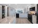 Bright kitchen with stainless steel appliances, granite counters, and open floor plan at 14950 Gulf Blvd # 902, Madeira Beach, FL 33708