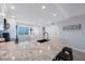 Spacious kitchen with granite countertops, stainless steel appliances and easy access to the front door at 14950 Gulf Blvd # 902, Madeira Beach, FL 33708