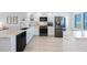 Modern, bright kitchen with stainless steel appliances and granite counters at 14950 Gulf Blvd # 902, Madeira Beach, FL 33708