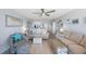Bright and open living room features contemporary decor and comfortable seating arrangement at 14950 Gulf Blvd # 902, Madeira Beach, FL 33708
