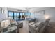 Inviting living room boasts stunning ocean views and features comfortable, stylish seating at 14950 Gulf Blvd # 902, Madeira Beach, FL 33708