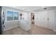 Convenient mud room with built-in storage, seating, and natural light from the window at 14950 Gulf Blvd # 902, Madeira Beach, FL 33708