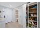 Well-stocked pantry with custom shelving and storage solutions for optimal organization and convenience at 14950 Gulf Blvd # 902, Madeira Beach, FL 33708