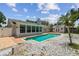 Backyard featuring a pool, privacy fence, shed and patio area at 15108 Winterwind Dr, Tampa, FL 33624