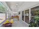 This bonus room features herringbone tile floors, shiplap walls, a foosball table, and ample natural light at 15108 Winterwind Dr, Tampa, FL 33624