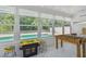 Bright game room with foosball table, arcade game and pool view at 15108 Winterwind Dr, Tampa, FL 33624