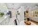 Spacious kitchen featuring modern appliances, white cabinetry, and open floor plan at 15108 Winterwind Dr, Tampa, FL 33624