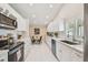 Bright kitchen with stainless steel appliances, ample cabinetry, and tiled floors at 15108 Winterwind Dr, Tampa, FL 33624