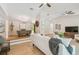 Bright living room showcasing hardwood floors, modern ceiling fans, and an open floor plan concept at 15108 Winterwind Dr, Tampa, FL 33624