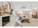 Open-concept living area with fireplace, hardwood floors, and access to the outdoors at 15108 Winterwind Dr, Tampa, FL 33624