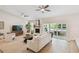 Bright and airy living room with modern furnishings, fireplace, and sliding glass doors to a covered patio at 15108 Winterwind Dr, Tampa, FL 33624