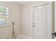 Bright mud room with door to the back and a window at 15108 Winterwind Dr, Tampa, FL 33624