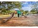 A colorful playground with slides and climbing equipment situated in a park-like setting at 15108 Winterwind Dr, Tampa, FL 33624