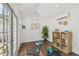 Bright shed interior featuring wood floors, neutral decor, and lots of natural light at 15108 Winterwind Dr, Tampa, FL 33624