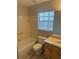 This bathroom features tile walls and flooring at 159 6Th Nw St, Largo, FL 33770