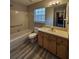 Clean bathroom with vanity, tub, and shower combo at 159 6Th Nw St, Largo, FL 33770