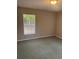 Neutral bedroom features a bright window and plush carpeting at 159 6Th Nw St, Largo, FL 33770