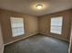 Bedroom with neutral carpet, paint, and natural light from two windows at 159 6Th Nw St, Largo, FL 33770