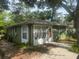 Exterior view of the home showcasing its architecture and well-maintained surroundings at 159 6Th Nw St, Largo, FL 33770