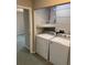 Laundry room showcasing the included washer and dryer at 159 6Th Nw St, Largo, FL 33770