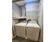 Bright laundry room with washer, dryer and shelving at 159 6Th Nw St, Largo, FL 33770