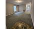 Living room featuring neutral paint, wall-to-wall carpet and natural light at 159 6Th Nw St, Largo, FL 33770