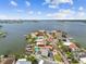 Waterfront properties on a point feature private docks, boat access, and stunning coastal views from above at 16106 6Th E St, Redington Beach, FL 33708