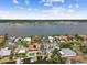 Aerial view of waterfront community with stunning water views, docks, and luxurious homes at 16106 6Th E St, Redington Beach, FL 33708