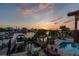 Sunset aerial view of the waterfront property with pool, dock, and serene water views at 16106 6Th E St, Redington Beach, FL 33708