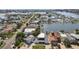 Aerial shot of a waterfront neighborhood with private docks, boat access, and well-maintained properties, promoting coastal charm at 16106 6Th E St, Redington Beach, FL 33708