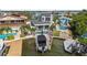 Waterfront property featuring a private pool, boat dock, and well-maintained exterior, ideal for boating and outdoor activities at 16106 6Th E St, Redington Beach, FL 33708
