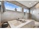 Relax in this bath with a view; the bathroom features a walk-in shower at 16106 6Th E St, Redington Beach, FL 33708